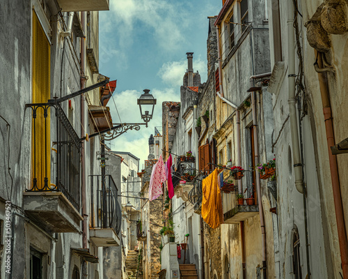Characteristic alley of the village of Vico del Gargano with clothes hanging out to dry in the spring sun.Vico del Gargano, province of Foggia, Puglia, Italy, Europe