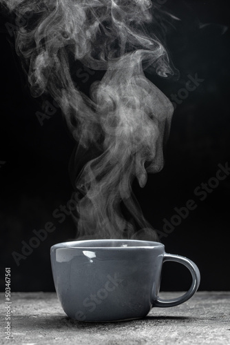 cup of coffee with steam on black background. Hot drink. hot steam with smoke, Culinary, cooking, concept