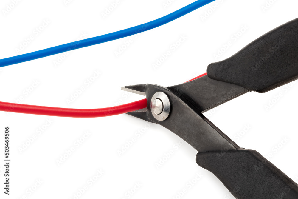 Side cutter diagonal wire cutting pliers with red and blue wires isolated on white background. clipping path