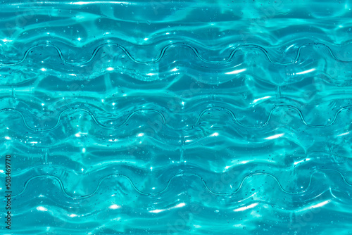 Texture of inflatable aqua color mattress on the water