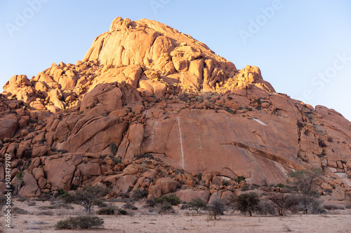 Impression of the Rocky Namibian Desert near Spitzkoppe during the golden hour around sunset.