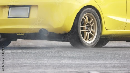 Gymkhana (motorsport) car racing spin around cone on track. photo