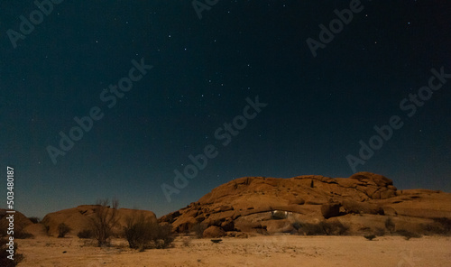 Night shot of the Namibian Desert near Spitzkoppe, under a clear starry southern sky.
