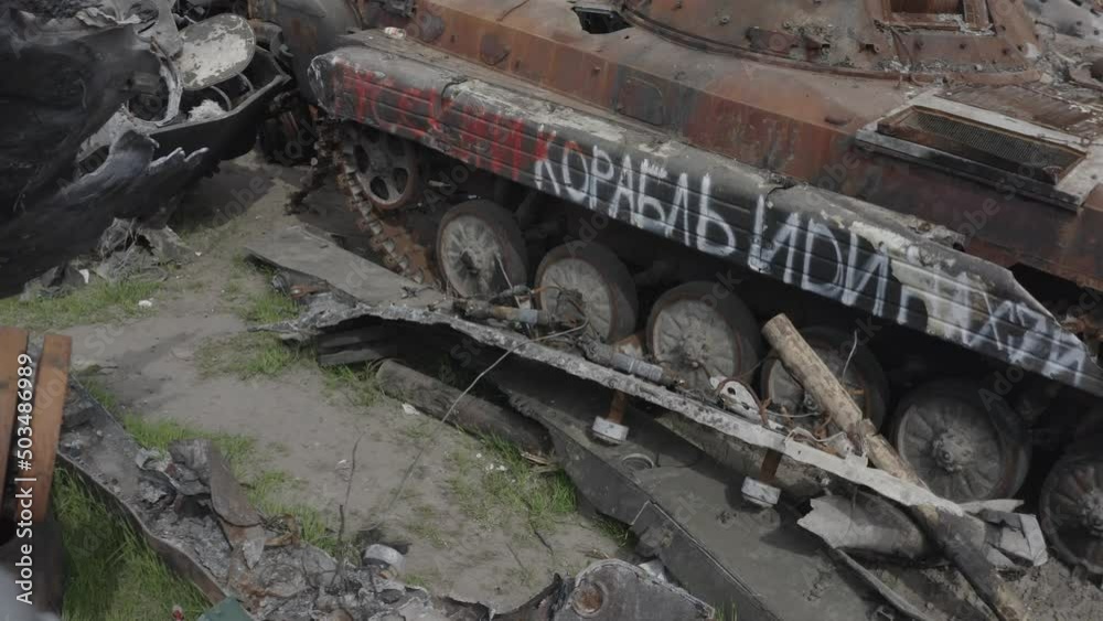 Destroyed military convoy. Burnt combat vehicles. Rusty tech. Consequences of an artillery strike. War in Ukraine. Bucha. Destroyed military convoy. Burnt combat vehicles. Rusty tech. Consequences of an artillery strike. War in Ukraine. Bucha.