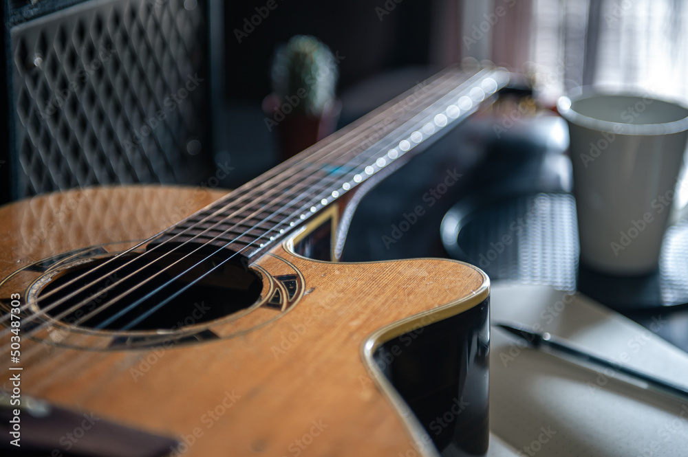 Fototapeta premium Close up, wooden acoustic guitar, musical creativity concept.
