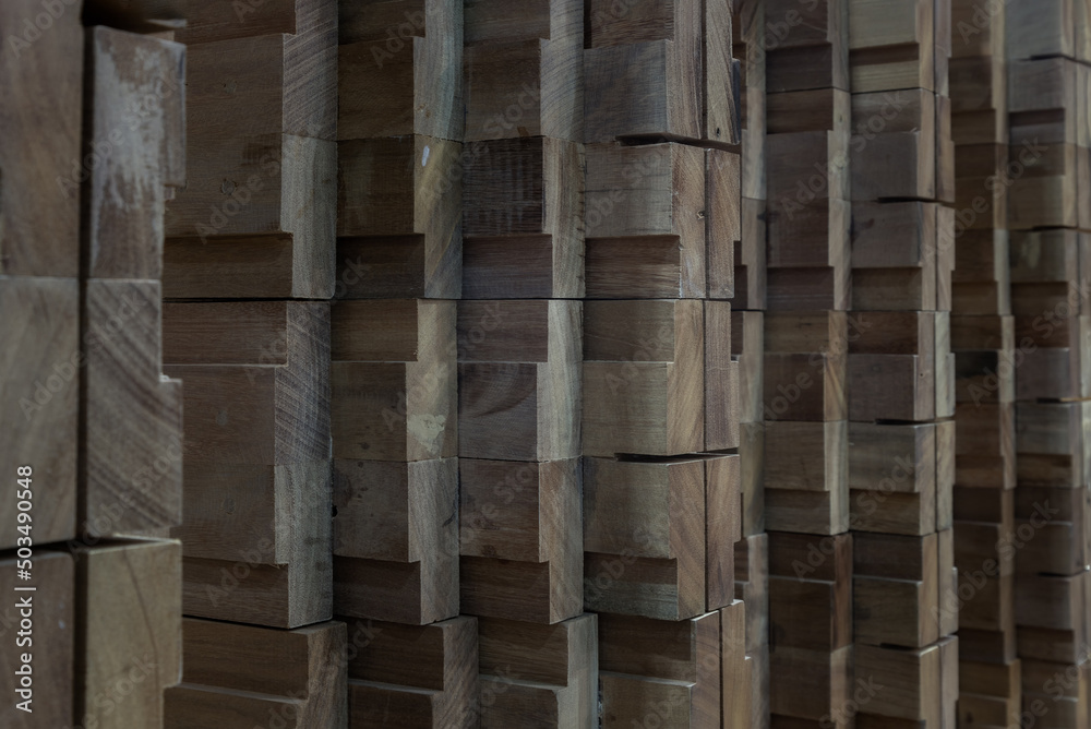 Lateral view of Wood that has been processed and cut, neatly arranged to form an interesting pattern. Copy space, Selective focus. Lateral view of Wood that has been processed and cut, neatly arranged to form an interesting pattern. Copy space, Selective focus.
