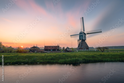 Ancient Windmills at dusk in Kinderdijk in Netherlands