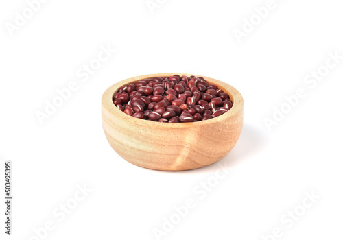 Adzuki beans or red mung beans in wooden bowl isolated on white background.