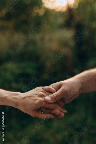 Closeup of loving couple holding hands © inna
