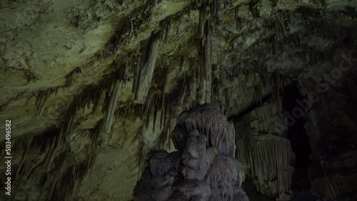 The cave of Zeus full of stalactites.A depths and a green cave.Down to up shot photo