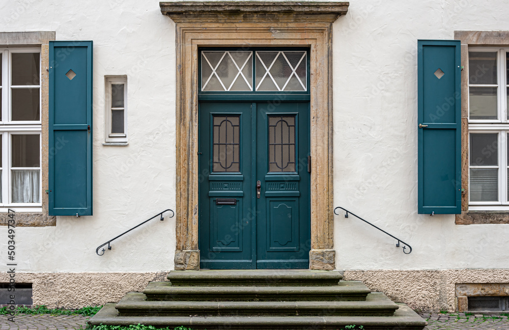 Vintage old doors and windows on the facade of the house. Stock Photo ...
