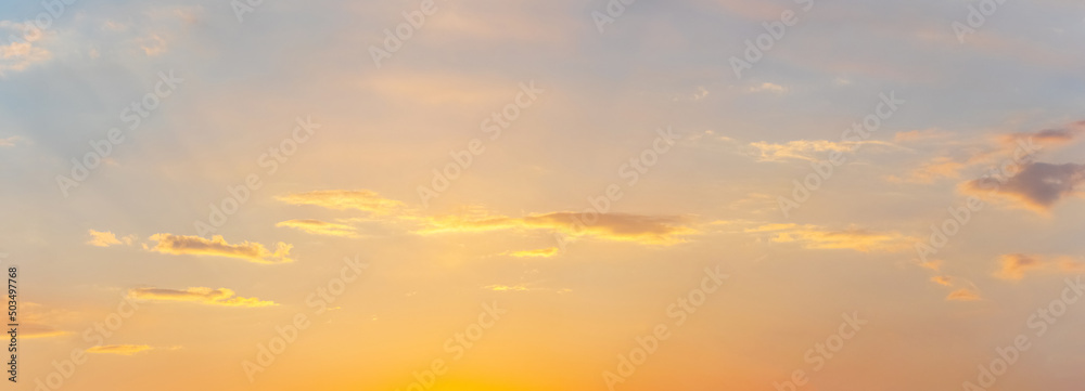 Sky with small clouds at sunset in soft pastel colors