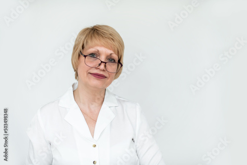 Portrait of a business woman with glasses and a white blouse on a white background.