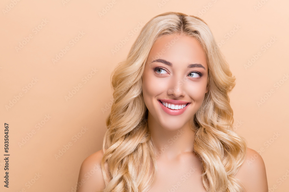 Portrait of attractive cheery curious wavy-haired girl silky skin think copy blank space isolated over beige pastel color background