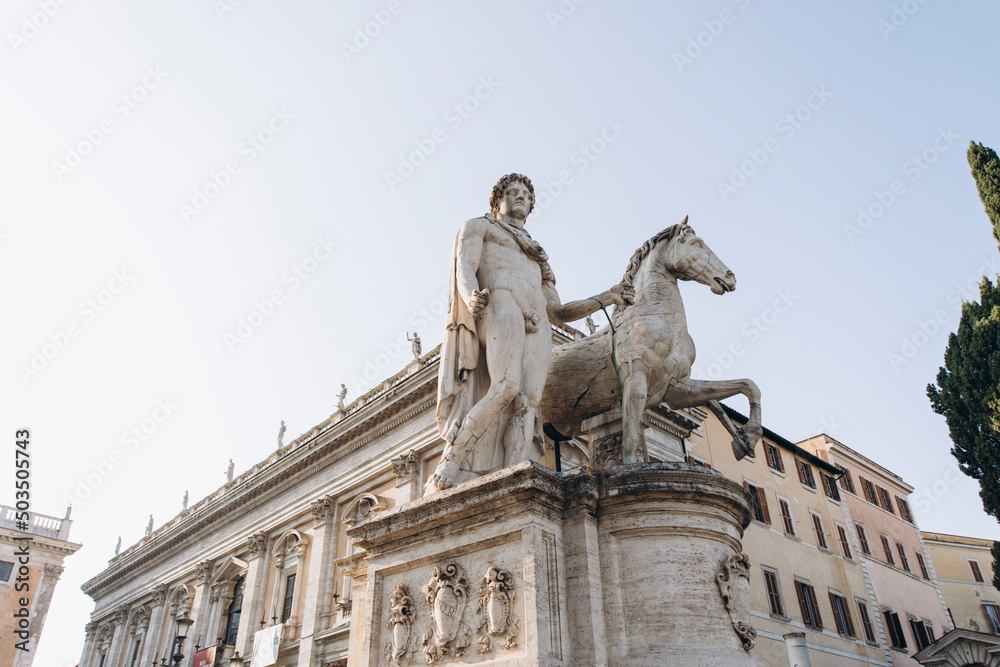 antique statue of a man with a horse. Roman stone statue of a man with a horse.