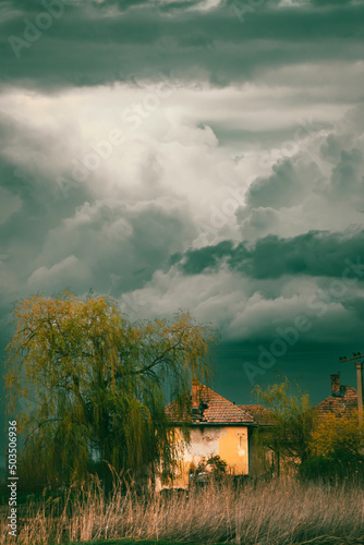 Old creepy haunted house on a stormy day