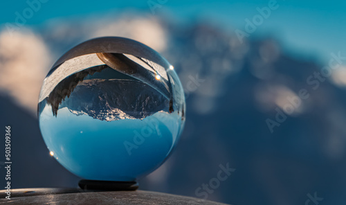 Crystal ball alpine winter landscape shot at the famous Zwoelferkopf summit, Achensee lake, Pertisau, Tyrol, Austria photo