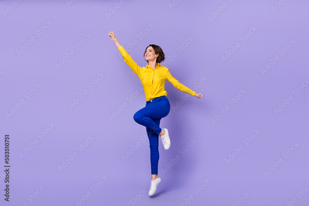 Full body photo of hooray young lady jump wear smart casual isolated on violet background
