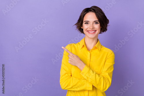 Photo of cute young bob hairdo lady index promo wear yellow blouse isolated on violet color background
