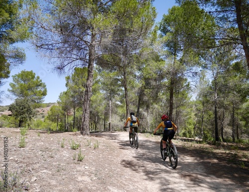 Mountain bikers in Laguna de Ruidera nature park. Castile La Mancha, Spain.