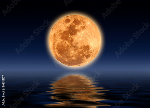 full moon reflecting water in the night