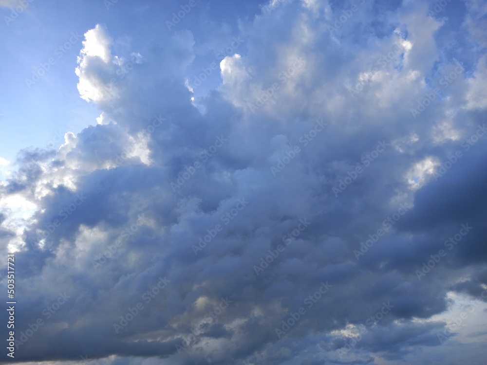 cumulonimbus seed with blue sky and shiny sun from right side cumulonimbus seed with blue sky and shiny sun from right side