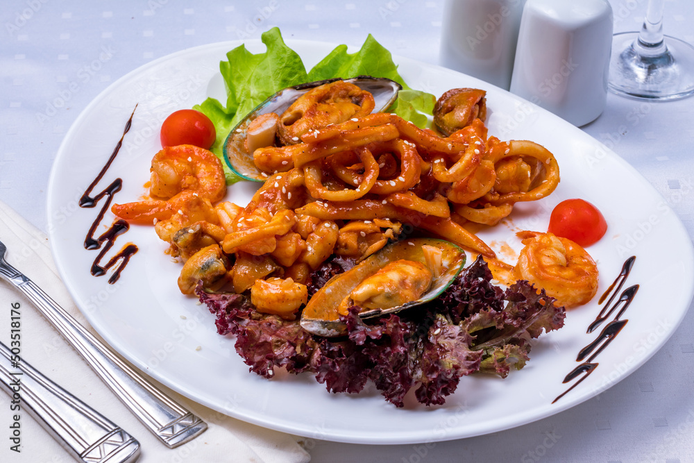 Salad with seafood on a white plate Salad with seafood on a white plate