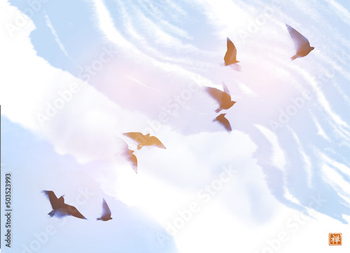 Ink painting with flock of birds on blue sky background. Traditional oriental ink painting sumi-e, u-sin, go-hua. Translation of hieroglyph - zen