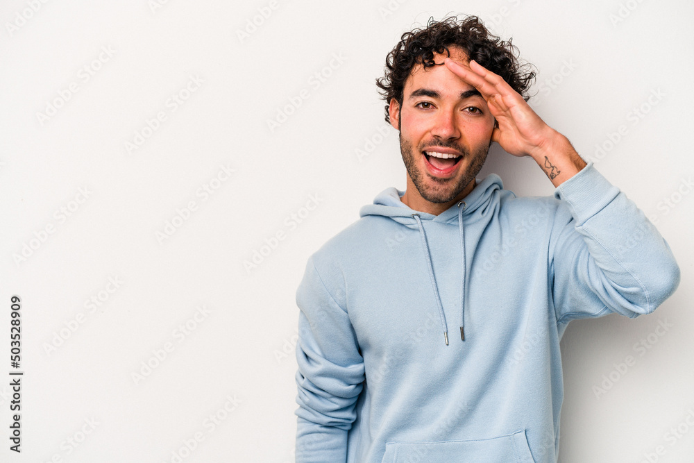 Young caucasian man isolated on white background shouts loud, keeps eyes opened and hands tense. Young caucasian man isolated on white background shouts loud, keeps eyes opened and hands tense.