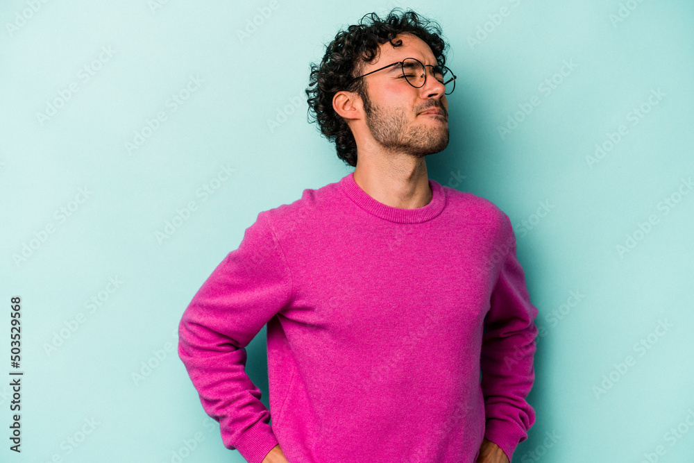 Young caucasian man isolated on white background suffering a back pain. Young caucasian man isolated on white background suffering a back pain.