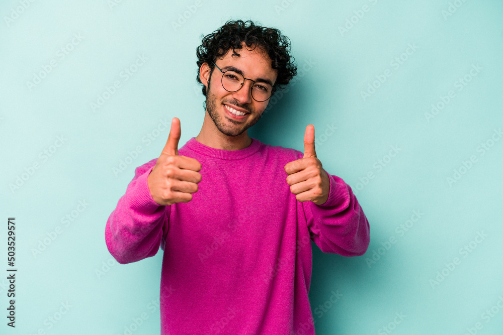 Young caucasian man isolated on white background raising both thumbs up, smiling and confident. Young caucasian man isolated on white background raising both thumbs up, smiling and confident.