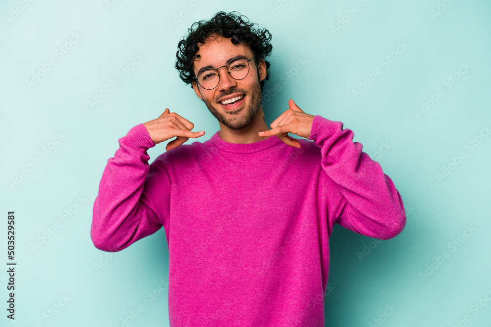 Young caucasian man isolated on white background showing a mobile phone call gesture with fingers. Young caucasian man isolated on white background showing a mobile phone call gesture with fingers.