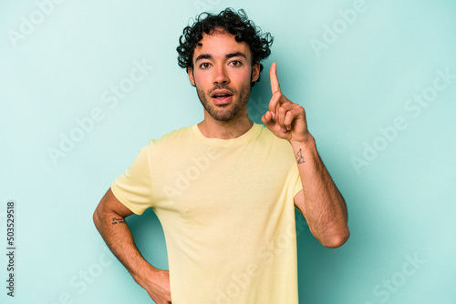 Young caucasian man isolated on white background having an idea, inspiration concept.