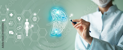 Unrecognizable female doctor holding graphic virtual visualization model of Spleen organ in hands. Multiple medical icons on the background. photo