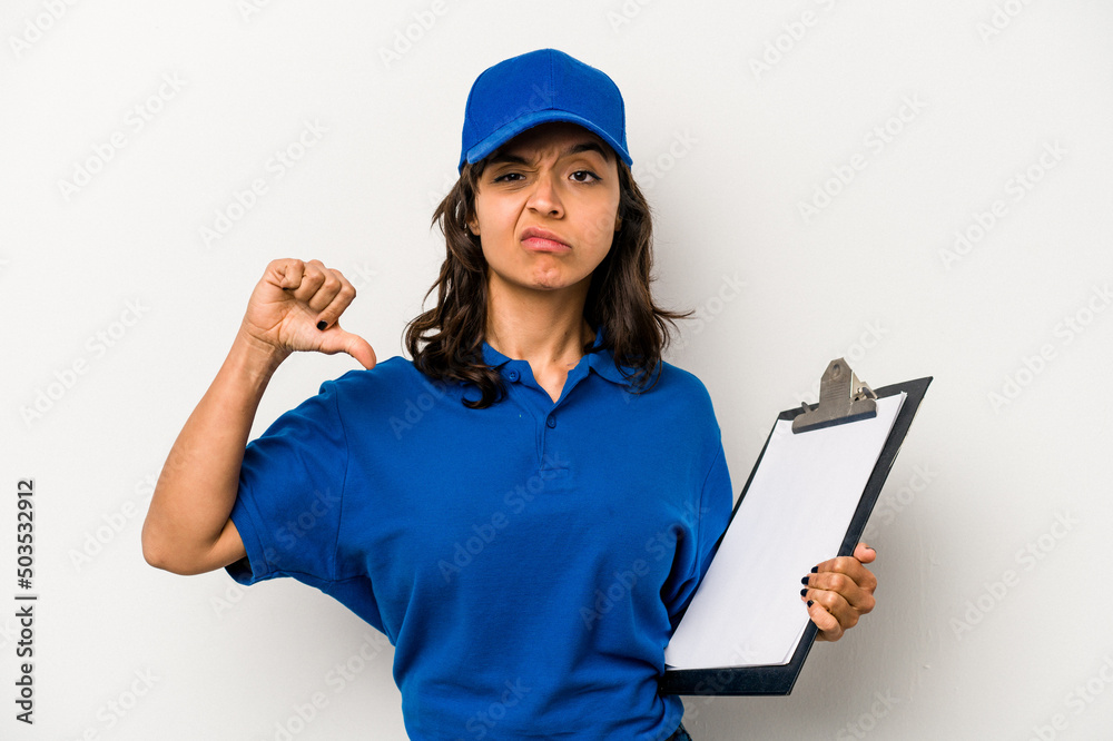 Young hispanic woman delivery man isolated on white background showing a dislike gesture, thumbs down. Disagreement concept. Young hispanic woman delivery man isolated on white background showing a dislike gesture, thumbs down. Disagreement concept.