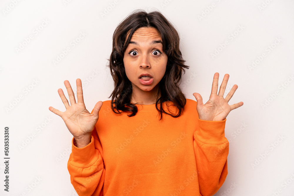 Young hispanic woman isolated on white background receiving a pleasant surprise, excited and raising hands. Young hispanic woman isolated on white background receiving a pleasant surprise, excited and raising hands.