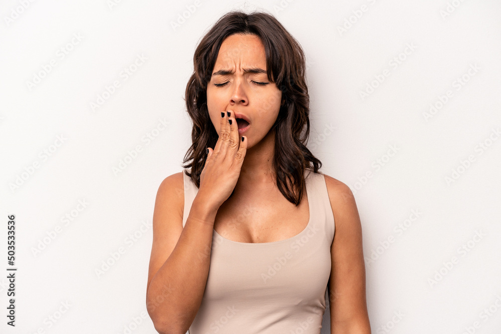 Young hispanic woman isolated on white background yawning showing a tired gesture covering mouth with hand. Young hispanic woman isolated on white background yawning showing a tired gesture covering mouth with hand.