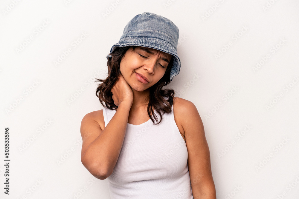 Young hispanic woman isolated on white background massaging elbow, suffering after a bad movement. Young hispanic woman isolated on white background massaging elbow, suffering after a bad movement.