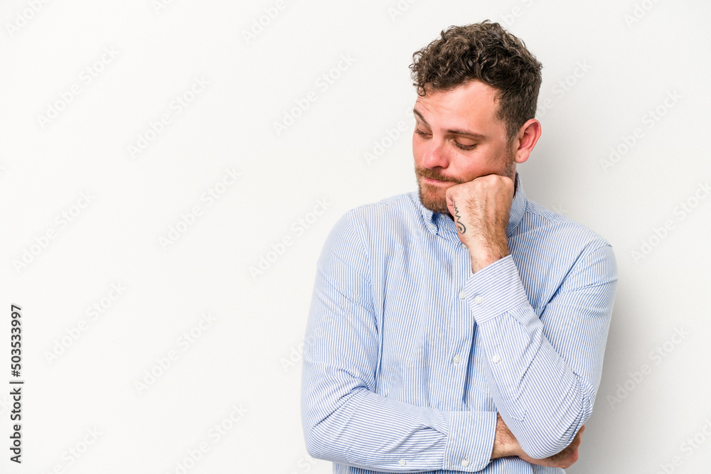 Young caucasian man isolated on white background looking sideways with doubtful and skeptical expression.