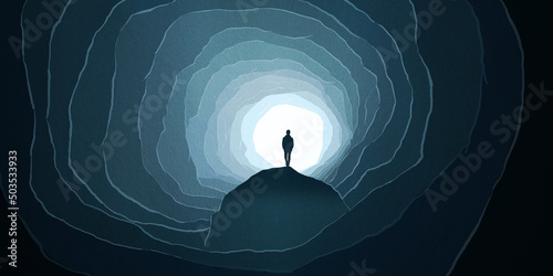 Silhouette of Man rock underground cave deep light