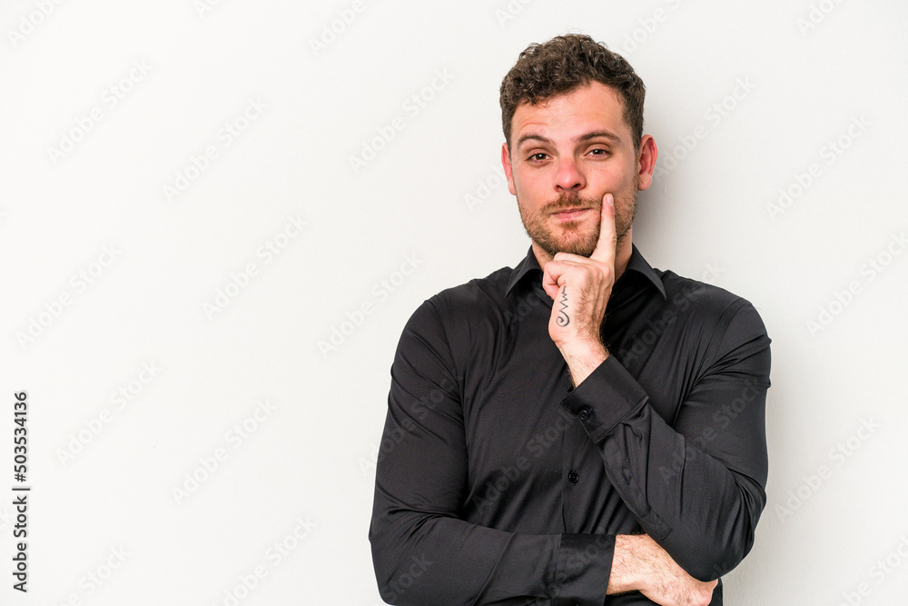 Young caucasian man isolated on white background looking sideways with doubtful and skeptical expression. Young caucasian man isolated on white background looking sideways with doubtful and skeptical expression.