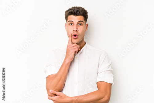 Young caucasian man isolated on white background having some great idea, concept of creativity. © Asier