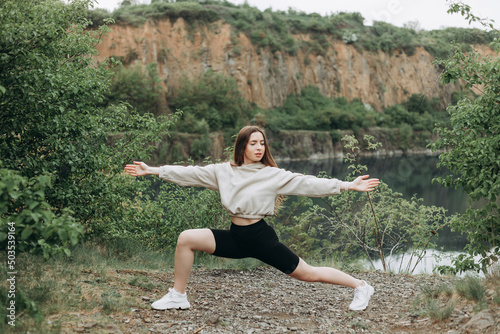 Woman do yoga relax outdoor. Woman exercising pose vital and meditation for fitness lifestyle club at the outdoors nature background. Healthy and Yoga Concept