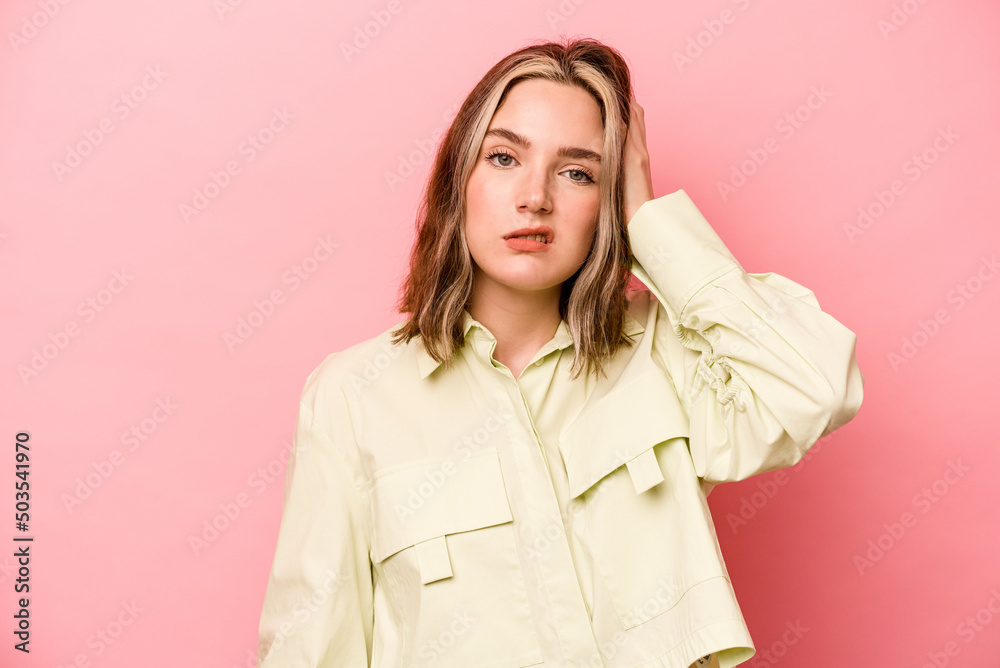 Young caucasian woman isolated on pink background tired and very sleepy keeping hand on head. Young caucasian woman isolated on pink background tired and very sleepy keeping hand on head.