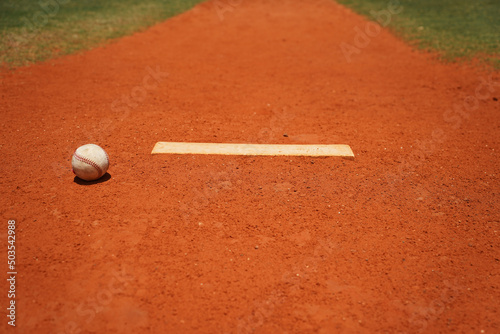 Baseball on pitchers mound on baseball field