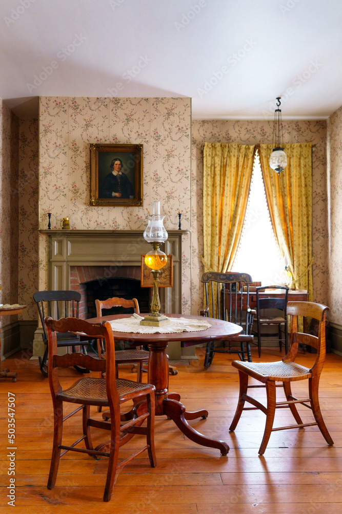 Antique living room with oil lamp. Seen in Black Creek Pioneer Village