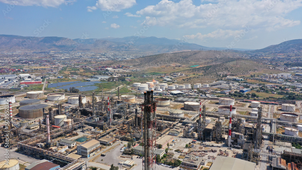 Aerial drone photo of oil and gas refinery processing plant burning gas torch flames in chimney