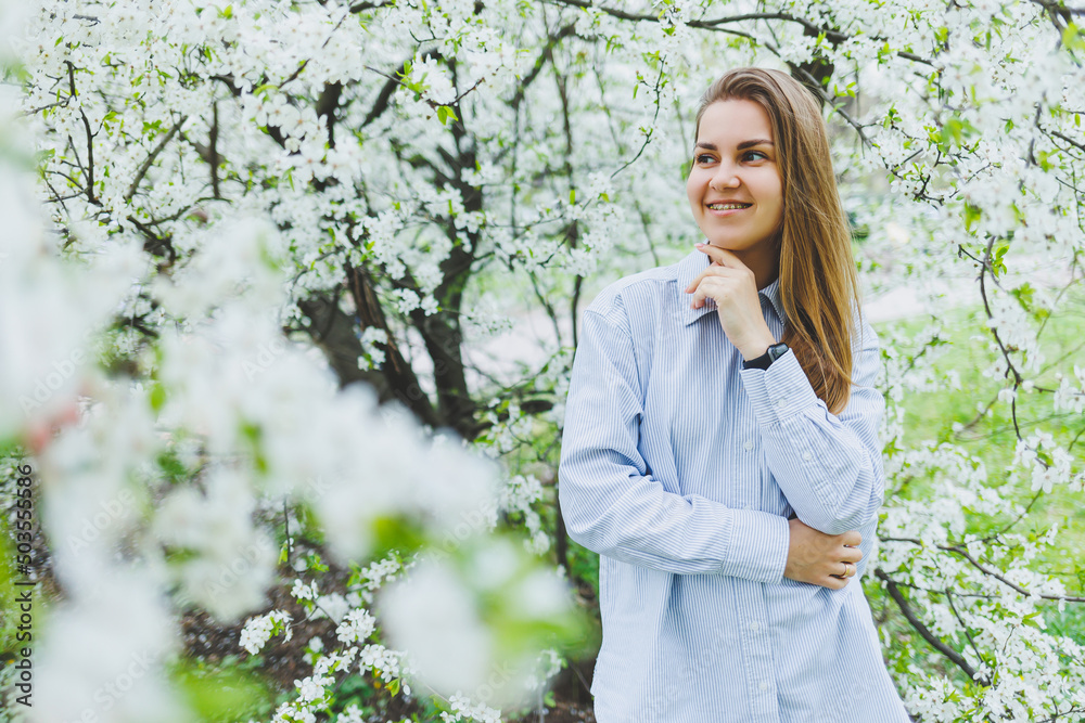 Portrait of beautiful romantic lady in apple trees blossoms Portrait of beautiful romantic lady in apple trees blossoms