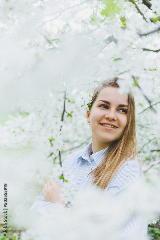 Portrait of beautiful romantic lady in apple trees blossoms Portrait of beautiful romantic lady in apple trees blossoms