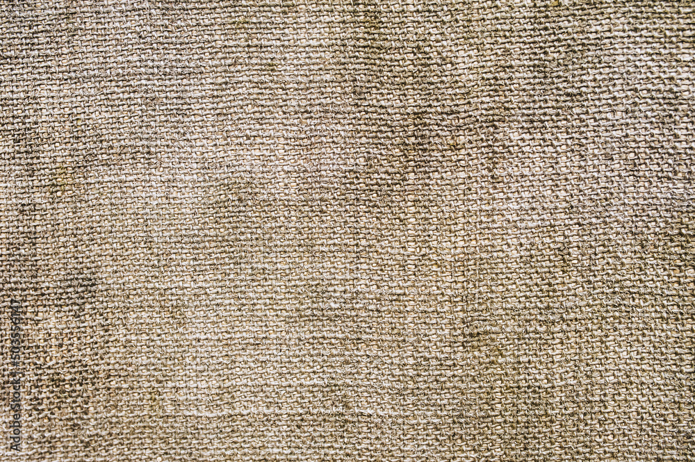 Background, texture of a fabric woven in spots of dirty burlap close-up. Photography, abstraction. Background, texture of a fabric woven in spots of dirty burlap close-up. Photography, abstraction.